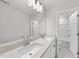 Bright bathroom with dual sinks, a wide mirror, and well-lit vanity at 376 Buckhorn Branch Park # 38, Clayton, NC 27520