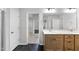 Well-lit bathroom featuring a dual vanity, ample counter space, and sleek, black marble tile flooring at 376 Buckhorn Branch Park # 38, Clayton, NC 27520
