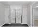 Bathroom featuring a modern shower, two doors, and beautiful, black marble tile flooring at 376 Buckhorn Branch Park # 38, Clayton, NC 27520