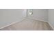 Minimalist bedroom with carpeted floors, neutral walls, and a window view at 376 Buckhorn Branch Park # 38, Clayton, NC 27520