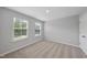 Cozy bedroom featuring two windows that allow natural light in and plush carpeting at 376 Buckhorn Branch Park # 38, Clayton, NC 27520