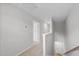 Upstairs hallway featuring carpet, white walls, and a staircase leading to the lower level at 376 Buckhorn Branch Park # 38, Clayton, NC 27520