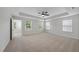 Spacious main bedroom with tray ceiling, carpet, fan, and lots of natural light at 376 Buckhorn Branch Park # 38, Clayton, NC 27520