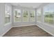 Bright sunroom with lots of natural light, wood floors, and large windows at 376 Buckhorn Branch Park # 38, Clayton, NC 27520
