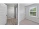 Large walk-in closet complete with wire shelving, ample storage, and a large mirror at 376 Buckhorn Branch Park # 38, Clayton, NC 27520
