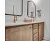 Modern bathroom features a double vanity with brass fixtures and a bright white countertop at 3812 Cobbler View Way, Fuquay Varina, NC 27526