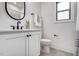 Modern bathroom features a sleek vanity, black fixtures, and a contemporary design at 3812 Cobbler View Way, Fuquay Varina, NC 27526