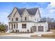 A spacious two-story home with a three-car garage and well-maintained front yard at 3812 Cobbler View Way, Fuquay Varina, NC 27526