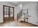 Bright foyer with wood floors, staircase, and a wooden front door at 3812 Cobbler View Way, Fuquay Varina, NC 27526
