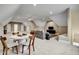 Spacious game room with a cozy seating area and a round table with chairs for Gathering time at 3812 Cobbler View Way, Fuquay Varina, NC 27526