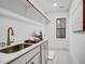 Bright laundry room features stylish sink, faucet, cabinets, and a window overlooking the outdoors at 3812 Cobbler View Way, Fuquay Varina, NC 27526