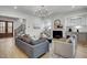 Living room featuring a fireplace, neutral decor, and hardwood floors at 3812 Cobbler View Way, Fuquay Varina, NC 27526