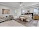 Spacious main bedroom features recessed lighting, large windows, and a cozy seating area at 3812 Cobbler View Way, Fuquay Varina, NC 27526
