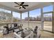 Relaxing screened porch with comfortable seating and views of the expansive backyard at 3812 Cobbler View Way, Fuquay Varina, NC 27526