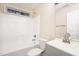 An inviting bathroom featuring a shower-tub combo, neutral walls, and a large mirror over the sink at 4102 Panther Creek Pkwy, Durham, NC 27704