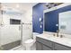A bright and stylish bathroom with a glass-enclosed shower, marble countertop, and modern fixtures at 4102 Panther Creek Pkwy, Durham, NC 27704