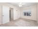 Inviting bedroom featuring neutral walls, plush carpeting, a ceiling fan and a window offering pleasant views at 4102 Panther Creek Pkwy, Durham, NC 27704