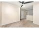 A spacious carpeted bonus room with natural light, a ceiling fan, and easy access to other living spaces at 4102 Panther Creek Pkwy, Durham, NC 27704