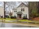 Charming two-story home featuring stone accents, a covered porch, and a well-maintained front lawn at 4102 Panther Creek Pkwy, Durham, NC 27704