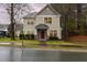 Charming two-story home featuring stone accents, a covered porch, and a well-maintained front lawn at 4102 Panther Creek Pkwy, Durham, NC 27704