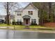 Traditional two-story home with well-maintained landscaping, including a dark wood door and stone accents at 4102 Panther Creek Pkwy, Durham, NC 27704