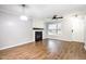 Bright living room featuring fresh neutral paint, a fireplace, and hardwood floors at 4102 Panther Creek Pkwy, Durham, NC 27704