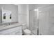 Well-lit bathroom featuring a granite countertop vanity, a toilet, and a shower with glass doors at 427 Rowe Way, Knightdale, NC 27545