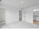 Clean, well lit bedroom with neutral carpet and an ensuite bathroom at 427 Rowe Way, Knightdale, NC 27545