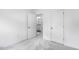 Spacious bedroom offers neutral carpet, white walls, and easy access to an ensuite bathroom and closet at 427 Rowe Way, Knightdale, NC 27545