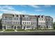 Charming townhome exteriors with varied neutral color schemes, stone accents, and well-manicured landscaping at 427 Rowe Way, Knightdale, NC 27545