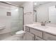 Bathroom featuring a glass-enclosed shower and a vanity with drawers at 428 Hampshire Ct, Four Oaks, NC 27524