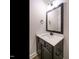 Bathroom features a modern vanity with a white countertop and black hardware at 428 Hampshire Ct, Four Oaks, NC 27524