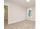 Bedroom with carpeted flooring, neutral walls and window views at 428 Hampshire Ct, Four Oaks, NC 27524