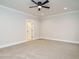 Spacious bedroom with carpet flooring, a ceiling fan, and neutral walls and trim at 428 Hampshire Ct, Four Oaks, NC 27524