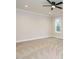 Bedroom with a ceiling fan, carpet flooring, and a window with a backyard view at 428 Hampshire Ct, Four Oaks, NC 27524
