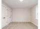 A bedroom with carpeted floors and two large closets featuring white doors at 428 Hampshire Ct, Four Oaks, NC 27524