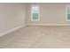 Spacious bedroom with plush carpeting and two windows at 428 Hampshire Ct, Four Oaks, NC 27524