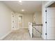 Hallway with carpeted flooring and neutrally painted walls leading to rooms at 428 Hampshire Ct, Four Oaks, NC 27524