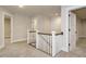 Upstairs hallway with plush carpet flooring and white doors and trim accents at 428 Hampshire Ct, Four Oaks, NC 27524