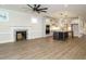 Open concept living space featuring a fireplace, hardwood floors, and a kitchen at 428 Hampshire Ct, Four Oaks, NC 27524