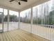 Enclosed patio with a wooden deck and screened walls at 428 Hampshire Ct, Four Oaks, NC 27524