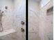 Beautiful shower with marble-patterned tile, bench seating, and a built-in shelf at 428 Hampshire Ct, Four Oaks, NC 27524
