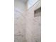 Luxurious shower with marble-patterned tiles and a built-in niche at 428 Hampshire Ct, Four Oaks, NC 27524