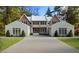 Beautifully rendered new home with white brick and mature trees at 4305 Windsor Pl, Raleigh, NC 27609