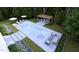 A lavish rectangular pool with a spa, lounge chairs, pergola, and meticulous landscaping at 4305 Windsor Pl, Raleigh, NC 27609