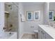 Bathroom featuring a tub and shower combo, vanity with white cabinets, and modern fixtures at 615 Contento Ct, Sanford, NC 27330