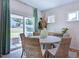 Cozy dining area with sliding glass doors to the backyard, showcasing the natural light and scenic views at 615 Contento Ct, Sanford, NC 27330