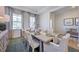 Well-lit dining room with neutral decor and table settings at 615 Contento Ct, Sanford, NC 27330