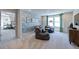 Spacious game room with comfortable seating, foosball table, stylish wallpaper, and plenty of natural light at 615 Contento Ct, Sanford, NC 27330