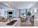 Open concept kitchen with an island bar connects to the dining and living areas, creating a social space at 615 Contento Ct, Sanford, NC 27330